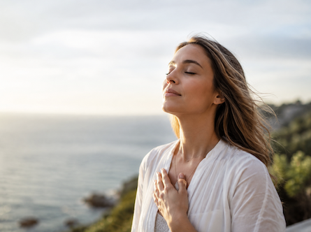 Lady breathing ocean