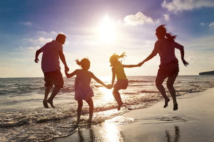 Family at ocean exercising